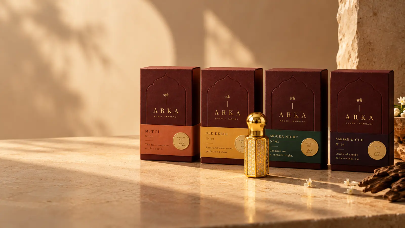 The Founding Four: Mitti, Old Delhi, Mogra Night and Smoke and Oud in their oxblood boxes, with a gold flacon